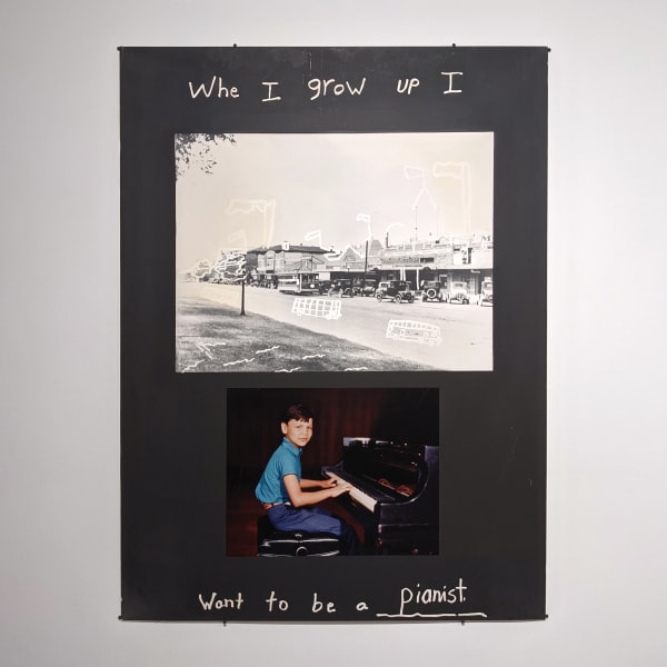 Two photographs on a black board, one is black and white of a street, the other is a young boy, the words “When I grow up, I want to be a pianist” written in silver pen on the top and bottom of the page