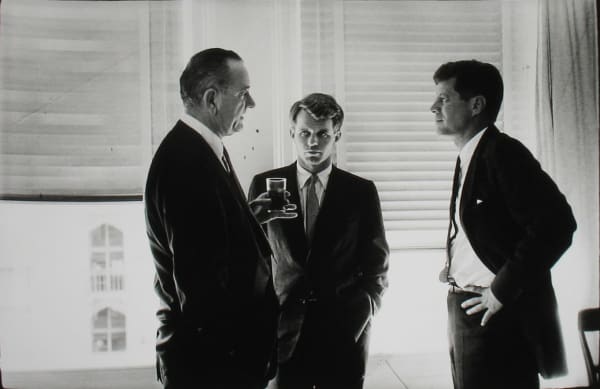 Black and white photograph of John F Kennedy, Bobby Kennedy, and Lyndon B Johnson in conversation at the Biltmore Hotel during the Democratic National Convention
