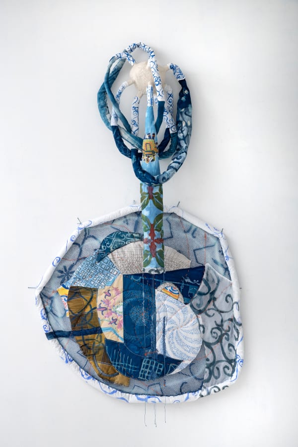 Fran Siegel Dispersed Painting, 2023 Porcelain form mounted to the wall, pigment and cyanotype on sewn and quilted fabric, scrim 70 x 42 x 16 inches 177.8 x 106.7 x 40.6 cm.