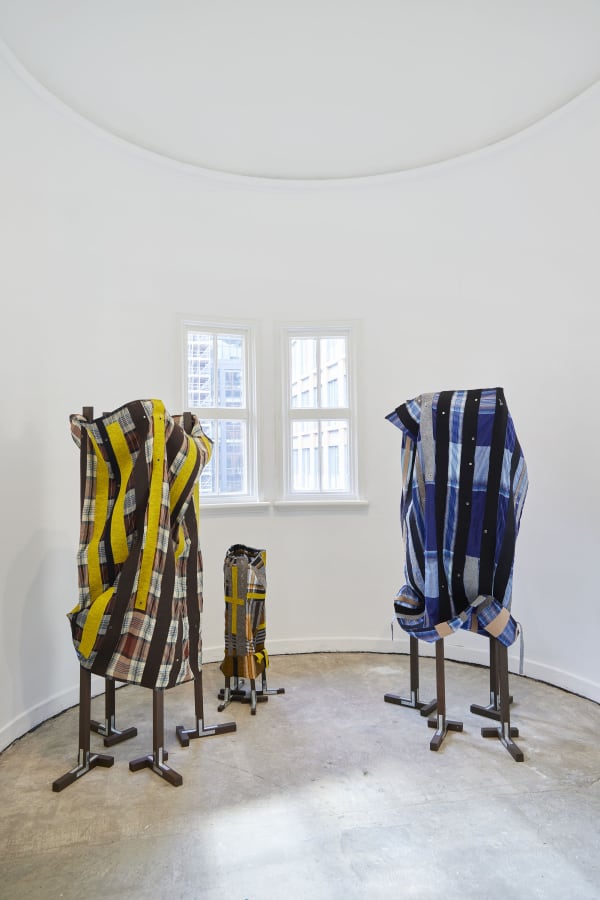 Haffendi Anuar Unit, 2021 Kain pelikat, natural and artificial felt, hemming tape, eyelets, metal brackets, wood, varnish, hooks. (father) 160 x 45 x 45 cm, (father) 150 x 45 x 45 cm, (child 1) 72 x 25 x 25 cm,