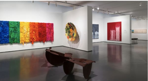 Installation view of “Generations: A History of Black Abstract Art,” Baltimore Museum of Art (Sept. 29, 2019-Jan. 19, 2020), Foreground, MELVIN EDWARDS, “A Conversation with Norman Lewis (1979), background, from left, SHINIQUE SMITH, “Black, Blue, Green, Yellow, Orange, Red, Pink” (2015), KEVIN BEASLEY, “Bronx Fitted” (2015), GARY SIMMONS, “Double Cinder” (2007). | Photo by Mitro Hood and Maximilian Franz, Courtesy Baltimore Museum of Ar