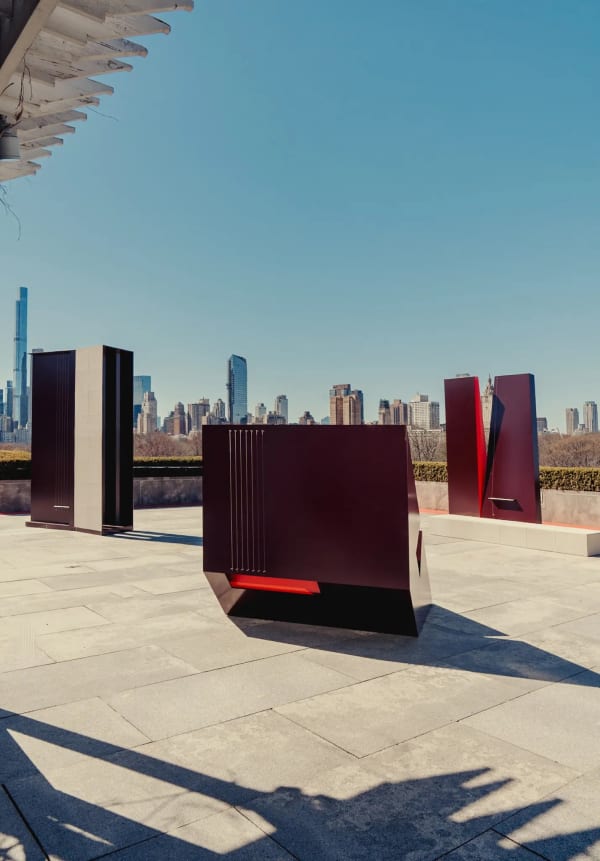 The Metropolitan Museum of Art roof commission, “Ensemble” by Jennie C. Jones, features three powder-coated aluminum-and-concrete sculptures inspired by stringed instruments. Lauren Rosati, 39, an associate curator, arranged for two musicians to be filmed playing music on the sculptures’ strings. Credit...Amir Hamja for The New York Times
