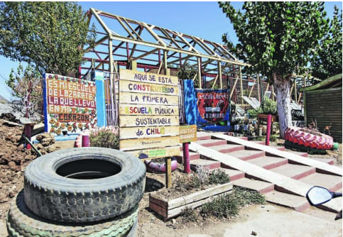 The façade under construction of the first sustainable school in Chile