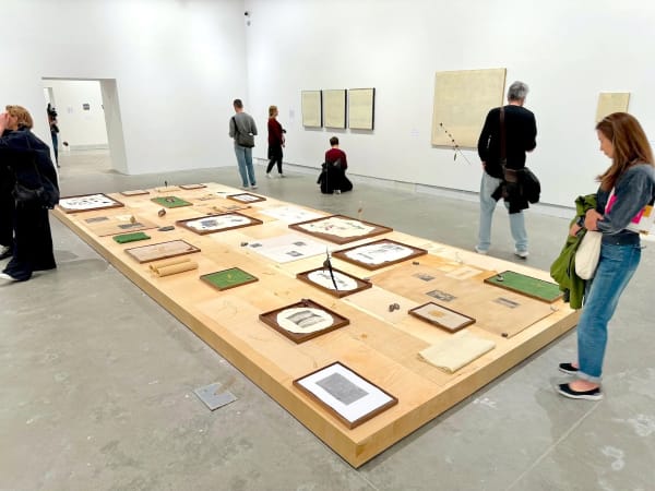 Kang Seung Lee, Untitled (Constellation) (2023) on the ground, with works by Romany Eveleigh on the wall behind. Photo by Ben Davis.