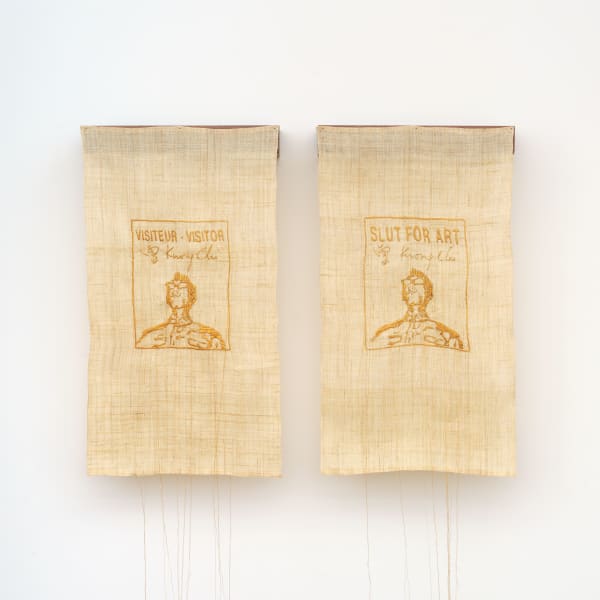 Untitled (Visitor and Slutforart badge, Tseng Kwong Chi), 2023 Antique 24k gold thread on sambe, brass nails, walnut wood Two parts: Approx. 24.5 x 14 x 3 inches each (62 x 36 x 8 cm) Overall dimensions: Approx. 24.5 x 29 x 3 inches (62 x 71 x 8 cm)
