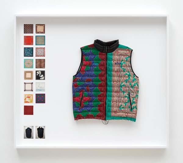 Simon Denny Power Vest 1, 2019 Scarves formerly owned by Margaret Thatcher, Patagonia M’s Down Sweater Vest parts, Down sourced from second hand San Francisco garments, Ripstop Nylon, Salesforce and Quip embroidered logos, wood, glass, photo paper, cardboard 52 3/4 x 60 1/4 x 9 1/8 in 134 x 153 x 23 cm