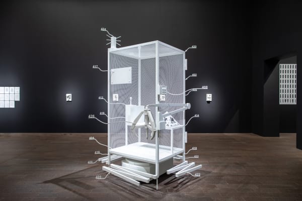 Simon Denny Amazon worker cage patent drawing as virtual King Island Brown Thornbill cage (US 9,280,157 B2: “System for transporting personnel within an active workspace”, 2016), 2019 Powder coated metal, MDF, plastic, digital print on cardboard, iOS Augemented Reality interface Installation view Uncanny Valley: Being Human in the Age of AI, 2020 de Young, San Francisco Photography by Gary Sexton