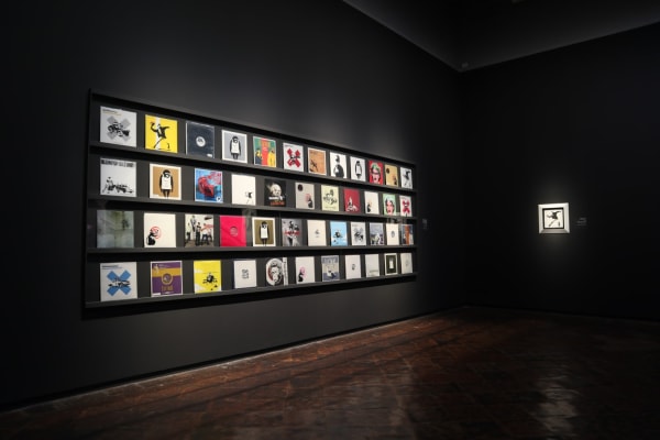 Banksy artwork hanging on wall