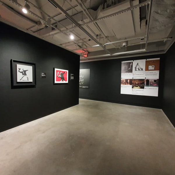 Banksy artworks hanging on wall