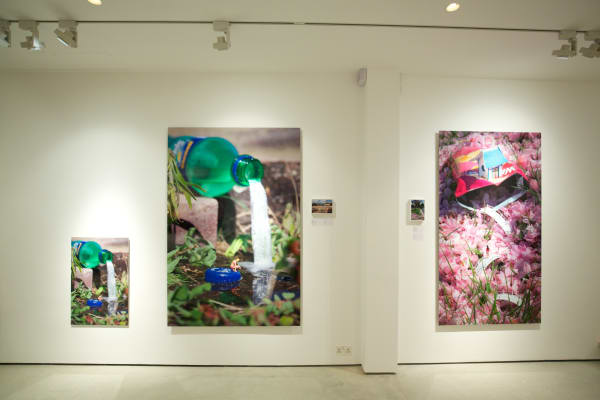 Slinkachu prints hanging in exhibition at andipa gallery.