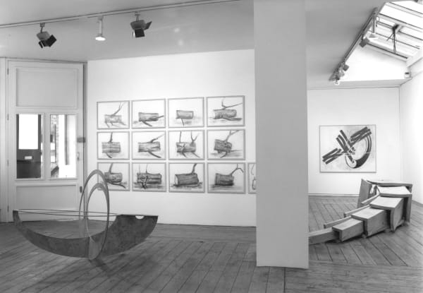 Left foreground: Sharing by Nigel Hall Right foreground: Extended Cube by David Nash Left background: Lumps with Lengths by David Nash Right background: Drawing No. 574 by Nigel Hall