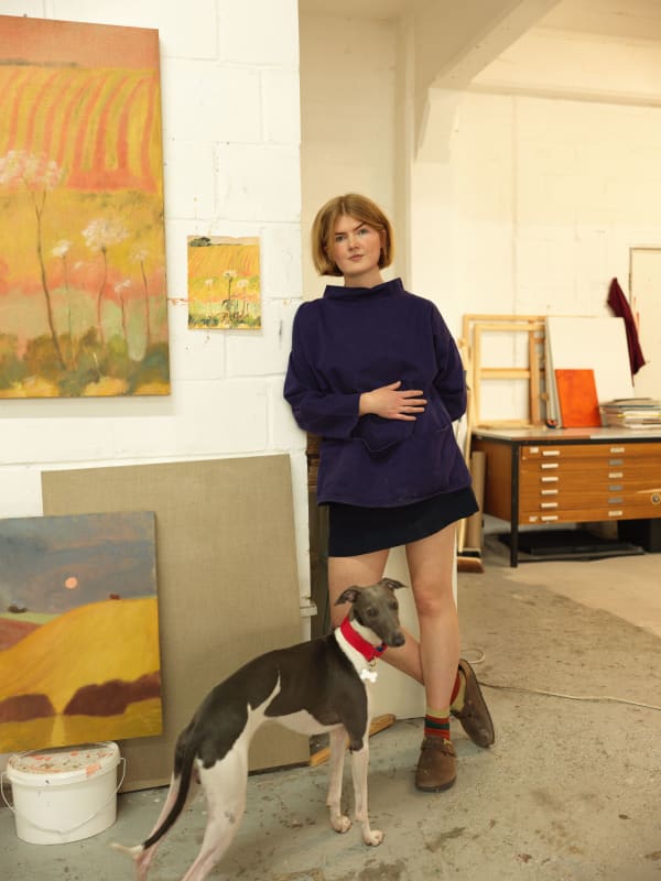 Sammi Lynch in her studio with her dog, Blue. Photography by Dham Srifuengfung