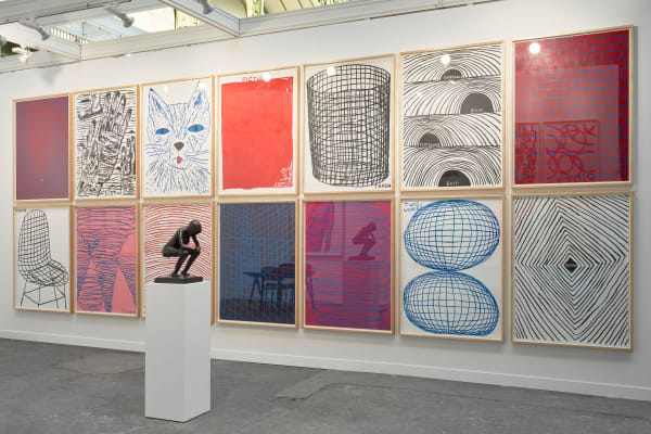 Solo booth of colorful David Shrigley paintings and sculptures.
