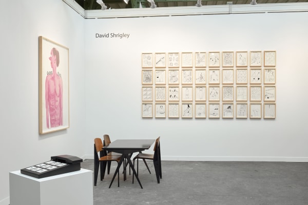 Solo booth of colorful David Shrigley paintings and sculptures.