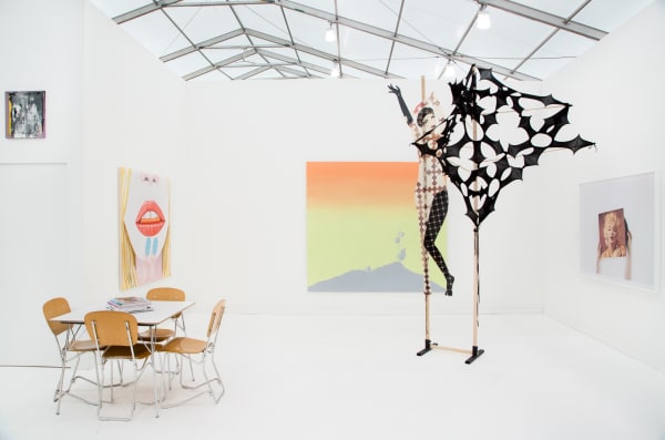 Group booth installation with gallery artists, including Anne Collier photography and Lara Schnitger's sculpture.
