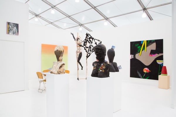 Group booth installation with gallery artists, including Anne Collier photography and Lara Schnitger's sculpture.