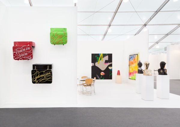 Group booth installation with gallery artists, including Anne Collier photography and Lara Schnitger's sculpture.