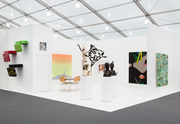 Group booth installation with gallery artists, including Anne Collier photography and Lara Schnitger's sculpture.