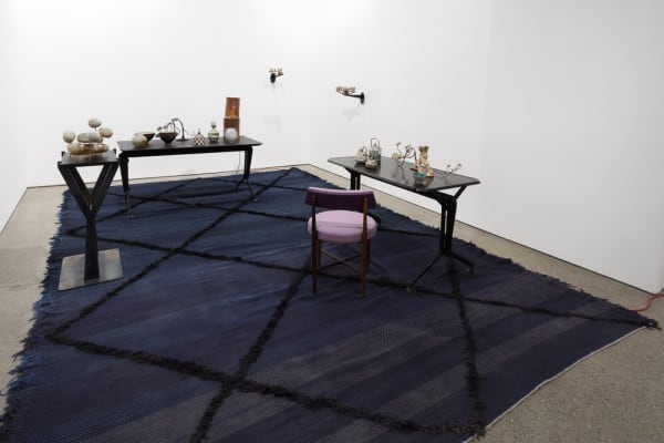 Installation view of Francis Upritchard and Martino Gamper's collaborative show. Gamper tables and smaller Upritchard sculptures.