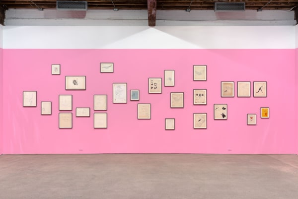 Installation view of Andy Warhol's solo show, featuring 170 of the artist's drawings. A wall of Warhol's worldly drawings.