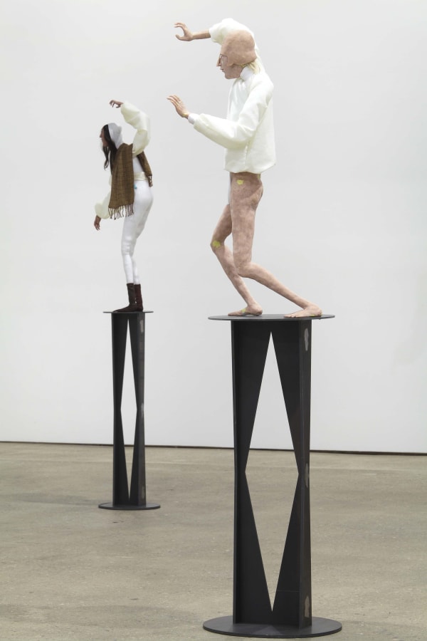 Installation view of Francis Upritchard's debut New York gallery show, featuring figurative and ritualistic sculptures as well as a collection of pots. Two figures shown.