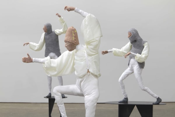 Installation view of Francis Upritchard's debut New York gallery show, featuring figurative and ritualistic sculptures as well as a collection of pots. Detail of three figures.