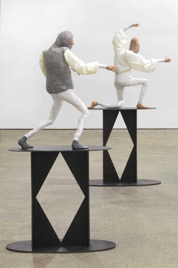 Installation view of Francis Upritchard's debut New York gallery show, featuring figurative and ritualistic sculptures as well as a collection of pots. Detail of two of the figures.