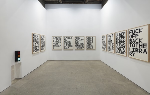 Installation view of David Shrigley's fifth solo show at Anton Kern Gallery, featuring signs. Featuring the back room signs.