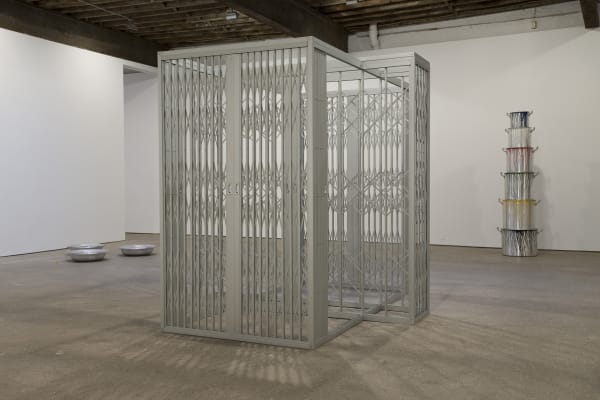 Installation view of Marepe's show entitled "Discompleto" consisting of sculpted works. Grade fotografica featured in this image.