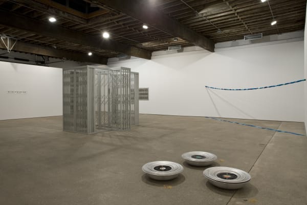 Installation view of Marepe's show entitled "Discompleto" consisting of sculpted works. A few works shown.