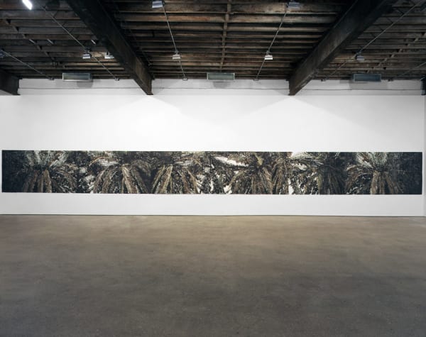 Installation view of Marcel Odenbach's 40-foot long paper collage panorama.