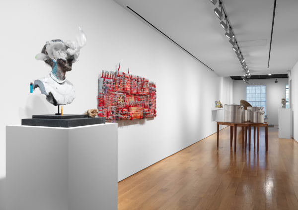 Group exhibition WirrWarr installation shots featuring works by gallery artists and others. David Altmejd, John Bock, and others are shown. David Atlmejd's surrealist bust titled Osiris next to Kari Cholnoky hung sculpture, titled Barricade.