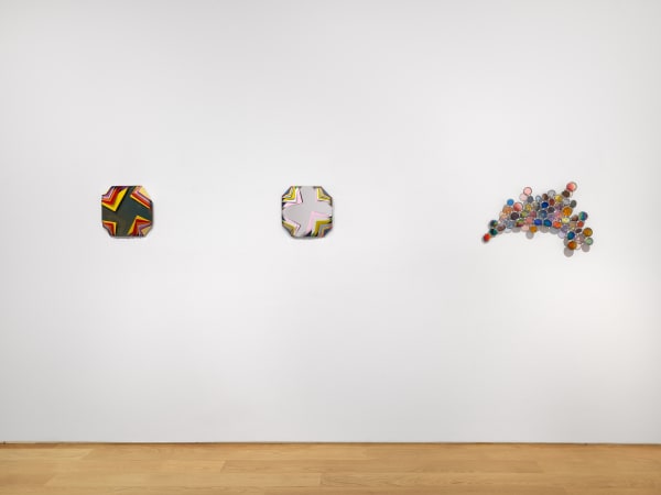 Installation view of Jim Lambie's works on the 3rd floor of the gallery featuring sunglass sculptures and metal boxes. Three works shown.