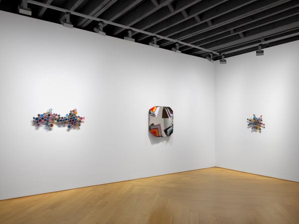 Installation view of Jim Lambie's works on the 3rd floor of the gallery featuring three works.