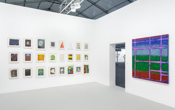Installation view of Chris Martin's solo exhibition at Frieze London 2015. Small-scale works and a medium-scale painting featured.