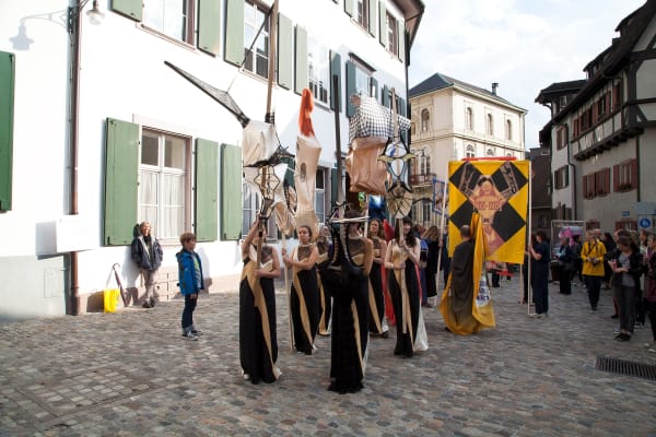 Installation view of Lara Schnitger's show at Basel Parcours, featuring a large body of works as well as a procession through Mezzeplatz. Commencing the procession.