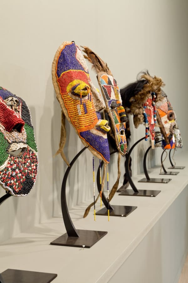 Installation view of Anton Kern Gallery's booth at Frieze London 2014. The show featured Mark Grotjahn and Tabwa Masks. Detail of the Tabwa masks.