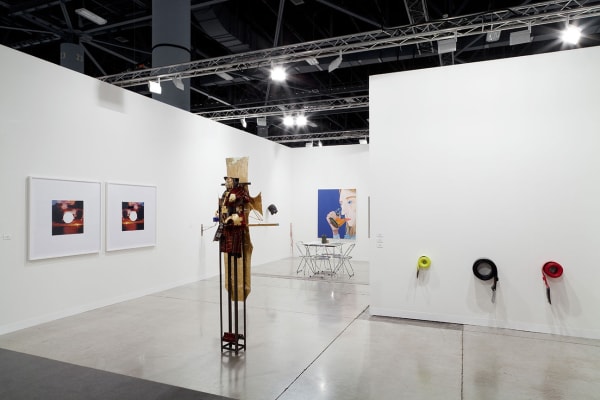 Installation view of Anton Kern booth at Art Basel Miami Beach 2013. Anne Collier represented on the left side of the view.