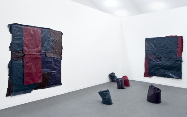 Installation view of Anton Kern Gallery's booth at Frieze London 2013, featuring works from Richard Hughes, Jim Lambie, and David Shrigley. Lambie's work featured.