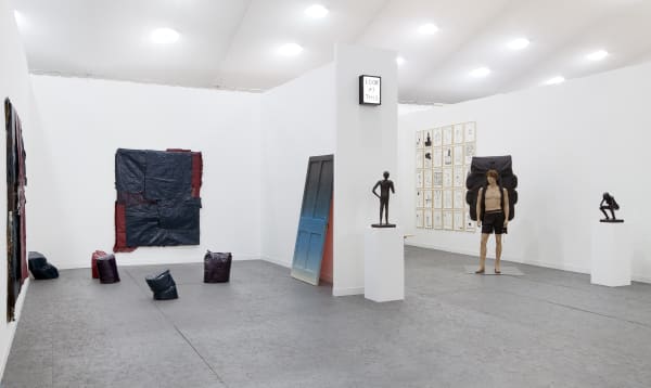 Installation view of Anton Kern Gallery's booth at Frieze London 2013, featuring works from Richard Hughes, Jim Lambie, and David Shrigley. All three artists featured.