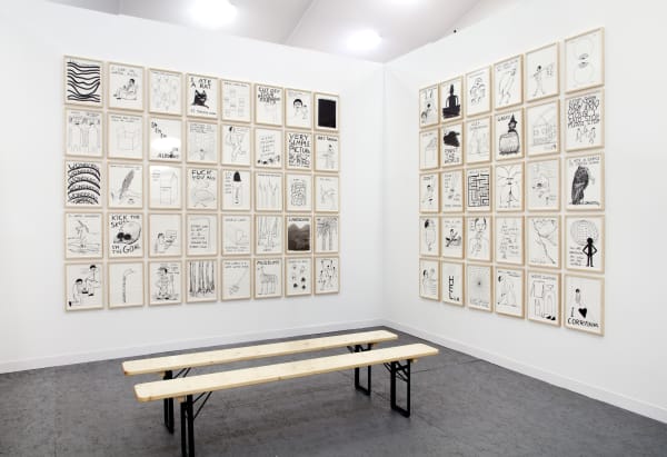 Installation view of Anton Kern Gallery's booth at Frieze London 2013, featuring works from Richard Hughes, Jim Lambie, and David Shrigley. The walls of Shrigley.