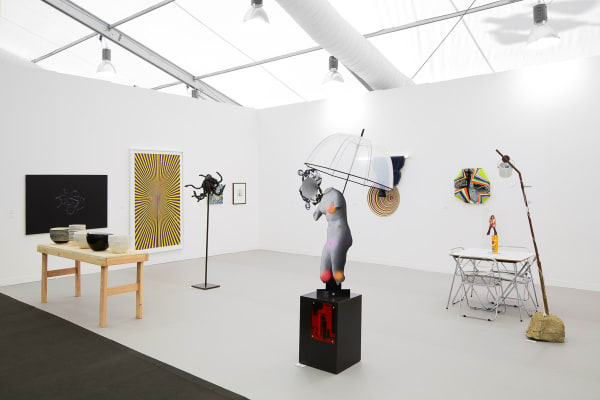 Installation view of the Anton Kern booth at Frieze London 2012. Lothar Hempel's umbrella motif sculpture featured.