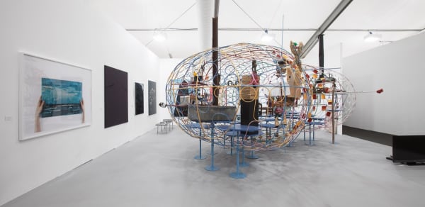 Installation view of the Anton Kern Booth at Frieze London 2010. John Bock's massive sculpture featured.
