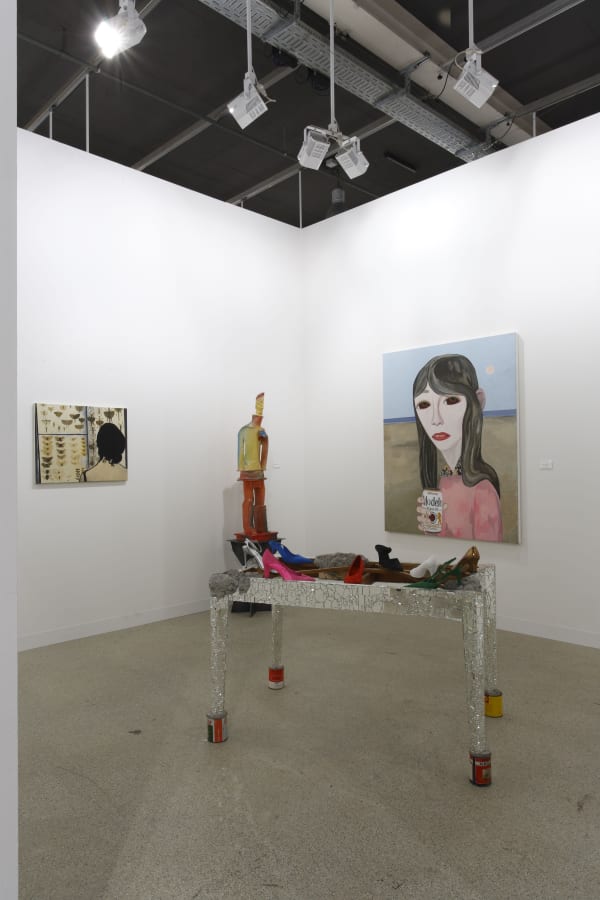 Installation view of the Anton Kern booth at Basel 2009, featuring Brian Calvin and Alessandro Pessoli.