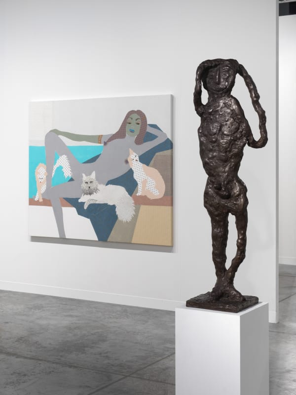 Installation view of Basel Miami booth day two hang. Lara Schnitger work and Tal R sculpture.