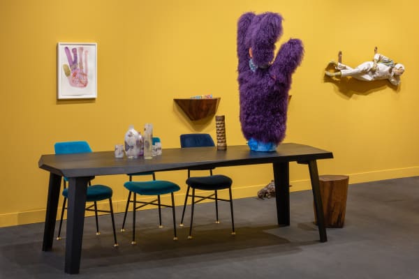 installation views of Martino Gamper and Francis Uprichard's works at the FOG art fair. Walls of fair are yellow. Sculpture, paintings and furniture shown.