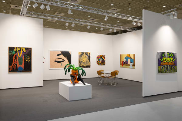 Installation view of Anton Kern Gallery booth at Frieze Seoul with white walls, dark floors, pedestal, sculpture, and paintings