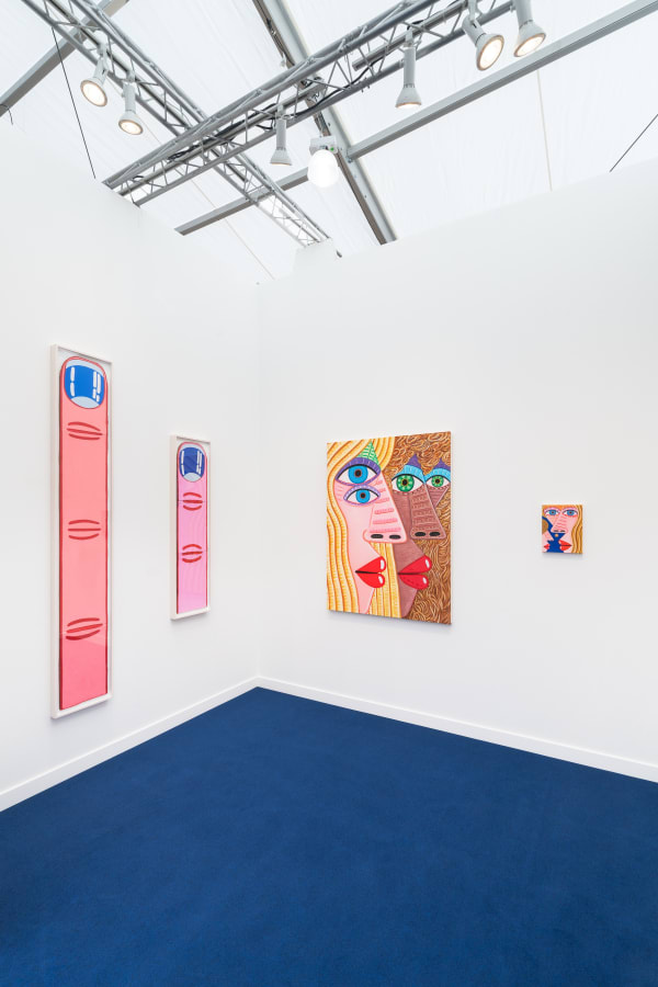 Installation view of Frieze Los Angeles 2023 booth C11 with view of blue floors, walls, artworks and ceiling.