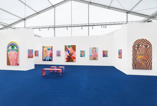 Installation view of Frieze Los Angeles 2023 booth C11 with view of blue floors, walls, artworks and ceiling.