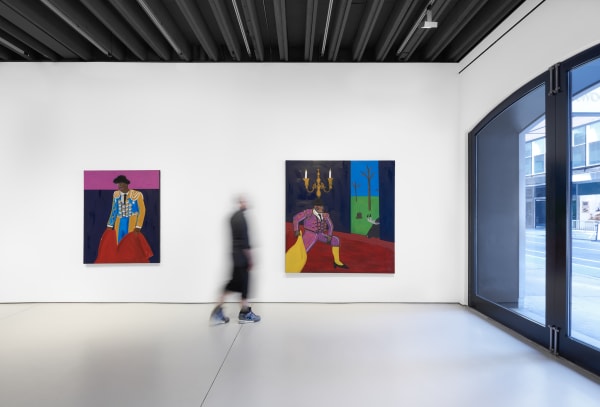 Installation view of the 2023 exhibition “Marcus Jahmal: Interiors” with view of person for scale, white floors, walls, artworks and ceiling.